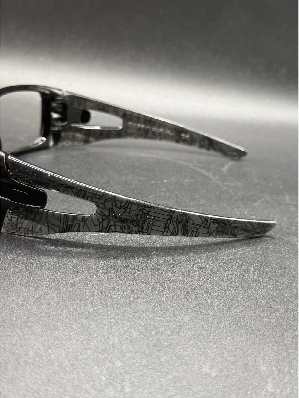 Oakley Crankcase Polished Black/Dark Grey History Text Frame (No Icons)
